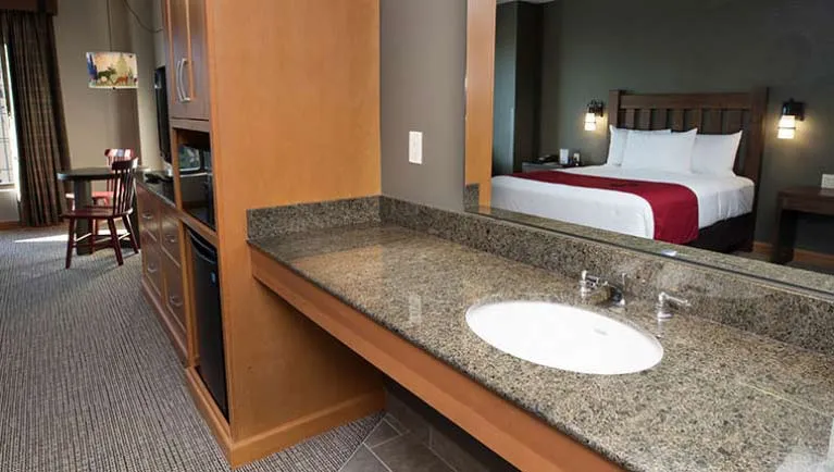 The sink and bed in the Deluxe Bunk Bed Suite